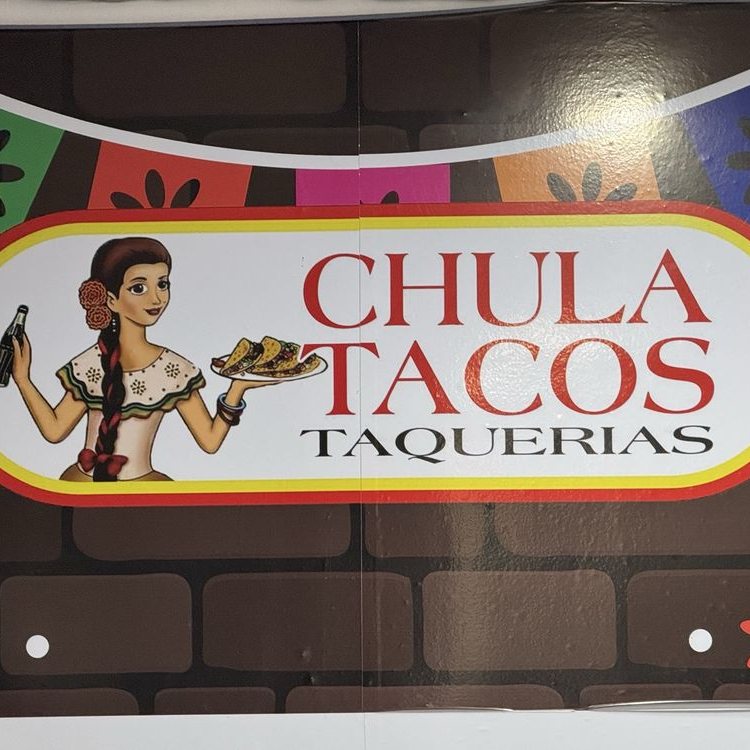 Chula Tacos Taquerias sign on the brick storefront