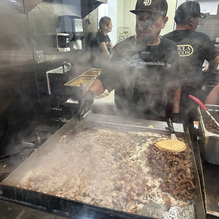 Meat cooking on the plancha at Chula Tacos